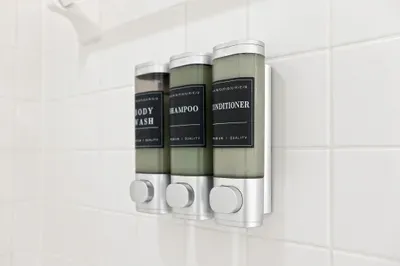 Hotel-style shower with mounted shampoo, conditioner, and body wash