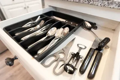 Organized kitchen drawer stocked with essential utensils and tools