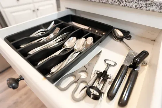 Organized kitchen drawer stocked with essential utensils and tools