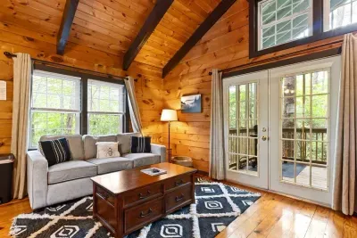 A cozy cabin with space to gather. The open-concept design makes it easy to cook, dine, and relax together.