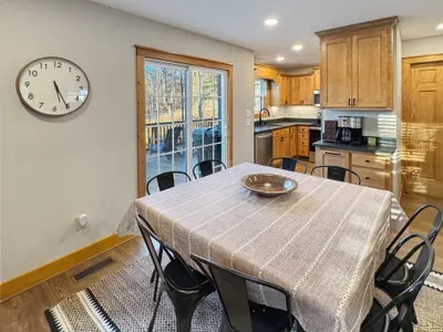 Savor every meal in this inviting dining space, featuring an open flow into the fully equipped kitchen. Whether you're enjoying a quick breakfast or a festive group dinner, this sun-drenched area keeps everyone connected and close to the action.
