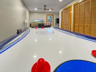 Game on! 🏒 Whether it’s a high-energy air hockey match or a competitive round of ping-pong, this space is built for fun. Grab a cold drink from the mini-fridge and settle into the 'chill zone' for a movie on the TV.