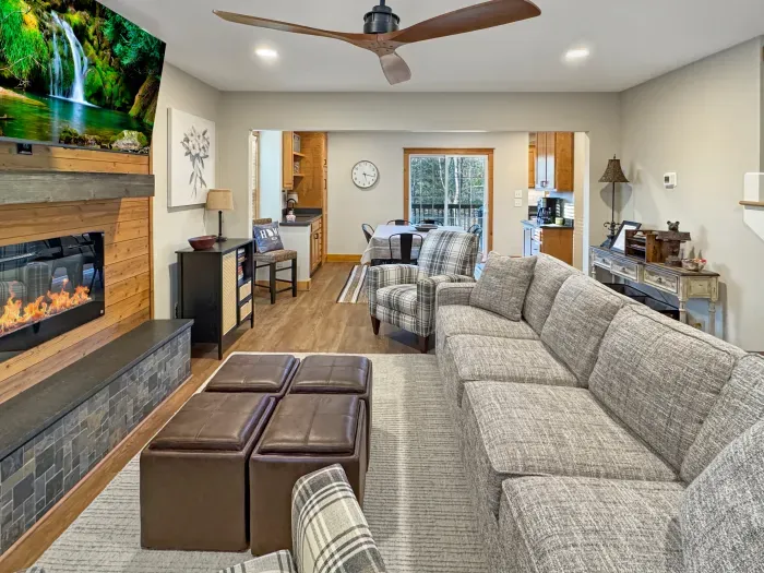 The heart of the home. ☀️ Settle into this sun-drenched, open-plan living room for morning coffee or evening stories by the fireplace. Designed for connection, it’s the perfect spot to gather before a day of mountain adventure.