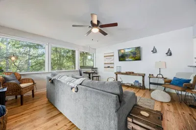 Open, light-filled second living area with forest views and plenty of room for everyone to spread out.