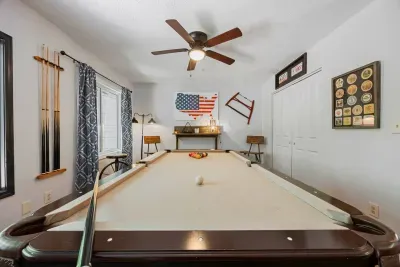 Enjoy endless entertainment with your own dedicated game room and pool table.