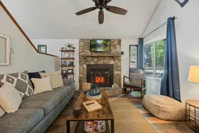 Cozy living room with a stone fireplace—perfect for unwinding after a day of exploring.