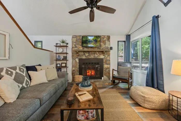 Cozy living room with a stone fireplace—perfect for unwinding after a day of exploring.