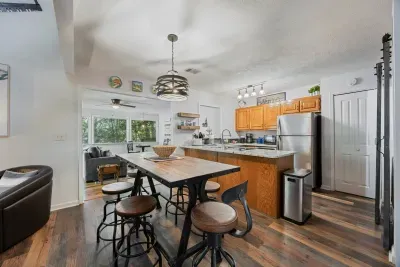 Fully equipped kitchen and dining space perfect for home-cooked meals and gathering together.