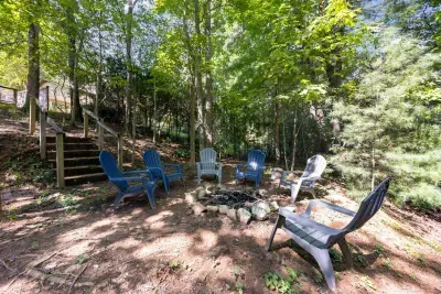 Gather around the wood-burning fire pit under the trees for cozy, unforgettable nights.