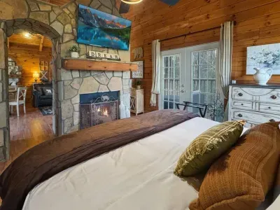 Wind down in bed with a favorite show and the soft glow of the fireplace