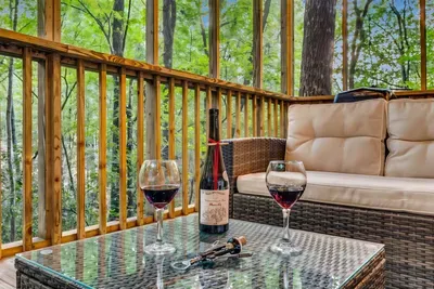 Sip wine on the deck, breathe in the forest air, and let the evening linger