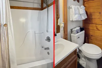 Cozy cabin bath with tub/shower, plush towels & handheld sprayer