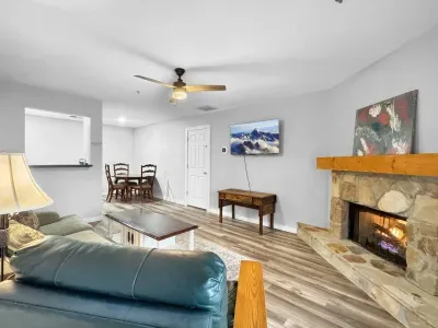 As the evening cools down, the fireplace becomes the heart of the space—warm, quiet, and easy.