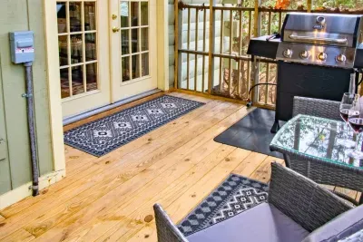 Outdoor grill station with seating and wine-ready deck — perfect for al fresco dining.