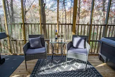Enjoy a glass of wine on the deck while taking in the forest views.
