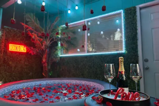 The private hot tub is indoors and out — this jetted spa inside the lounge is included in every stay. No upgrade needed.