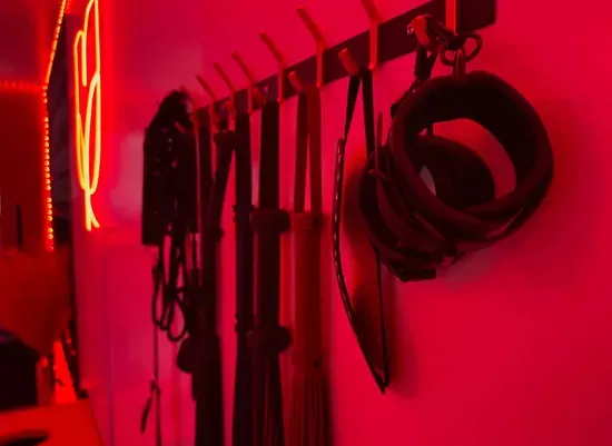 The wall of accessories — for the curious, the experienced, and everyone in between. Professionally sanitized after every stay.