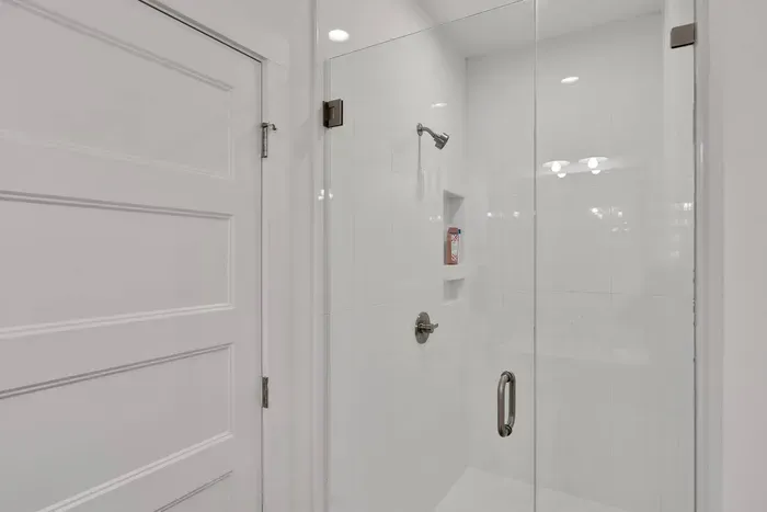 Step into the sleek, glass-enclosed shower