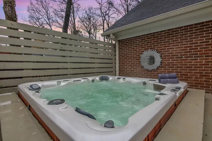 Relax and soak in the private hot tub after a long day.