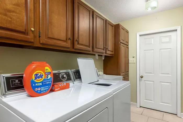 Laundry and dryer with detergent pods and dryer sheets.