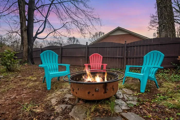 Circle around the fire pit and enjoy the serenity of the backyard.