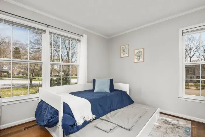 Trundle day bed with pull out twin, pillows, and a throw blanket. Bedding for the pull out is in the closet beneath the stairs. 