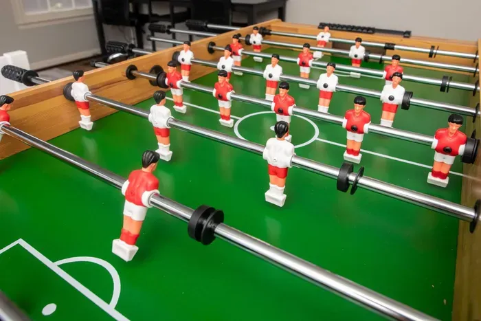 Enjoy some competitive fun with a game of foosball.