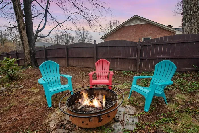 Circle around the fire pit and enjoy the serenity of the backyard.