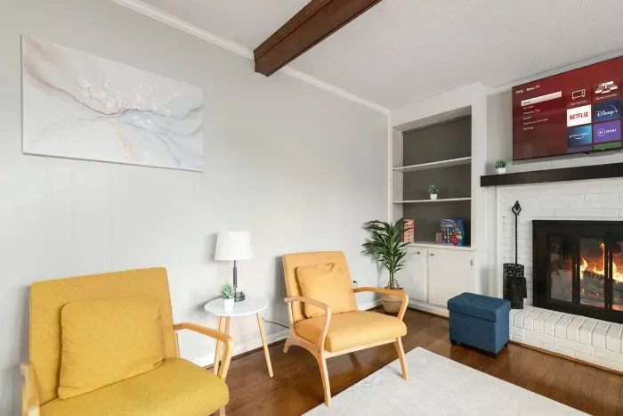 A 55-inch Smart TV is mounted above the fireplace.