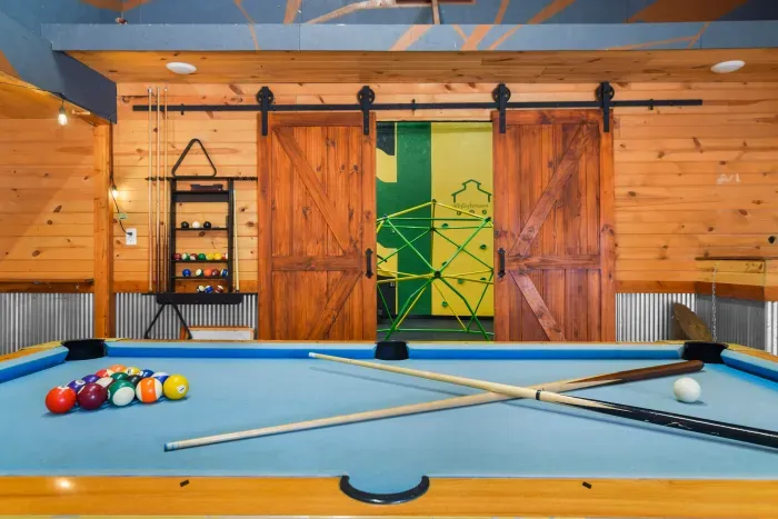 Billiards table in the party shed, below the second level plunge pool and sauna, and directly next to the indoor playground area.
