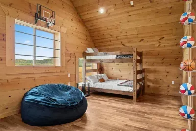 Bunk Loft Room with 2 Queen/Twin bunk beds and a mini basketball court!