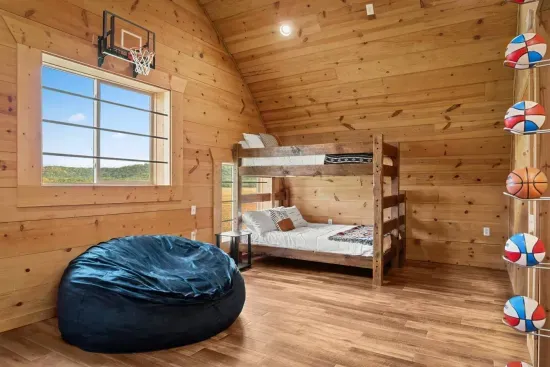 Bunk Loft Room with 2 Queen/Twin bunk beds and a mini basketball court!