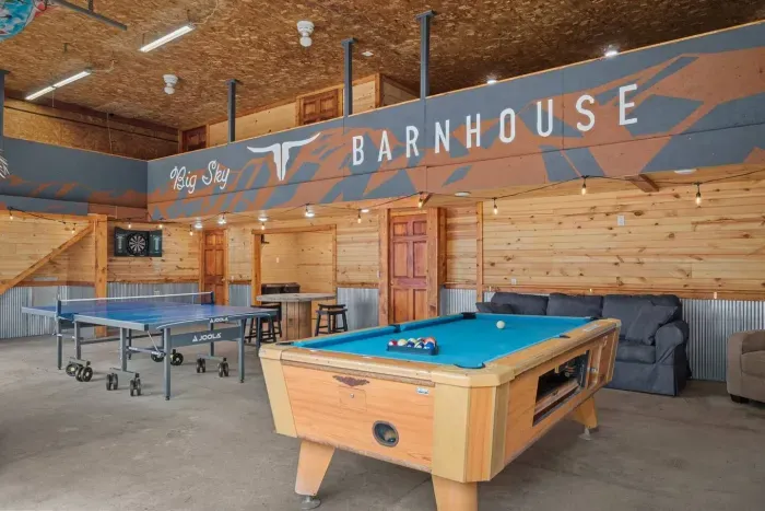 Party Shed! With a pool table, ping pong, darts, lounge area all on the first floor, second floor has a sauna and lap pool/hot tub. Plus a kitchenette and a fridge 