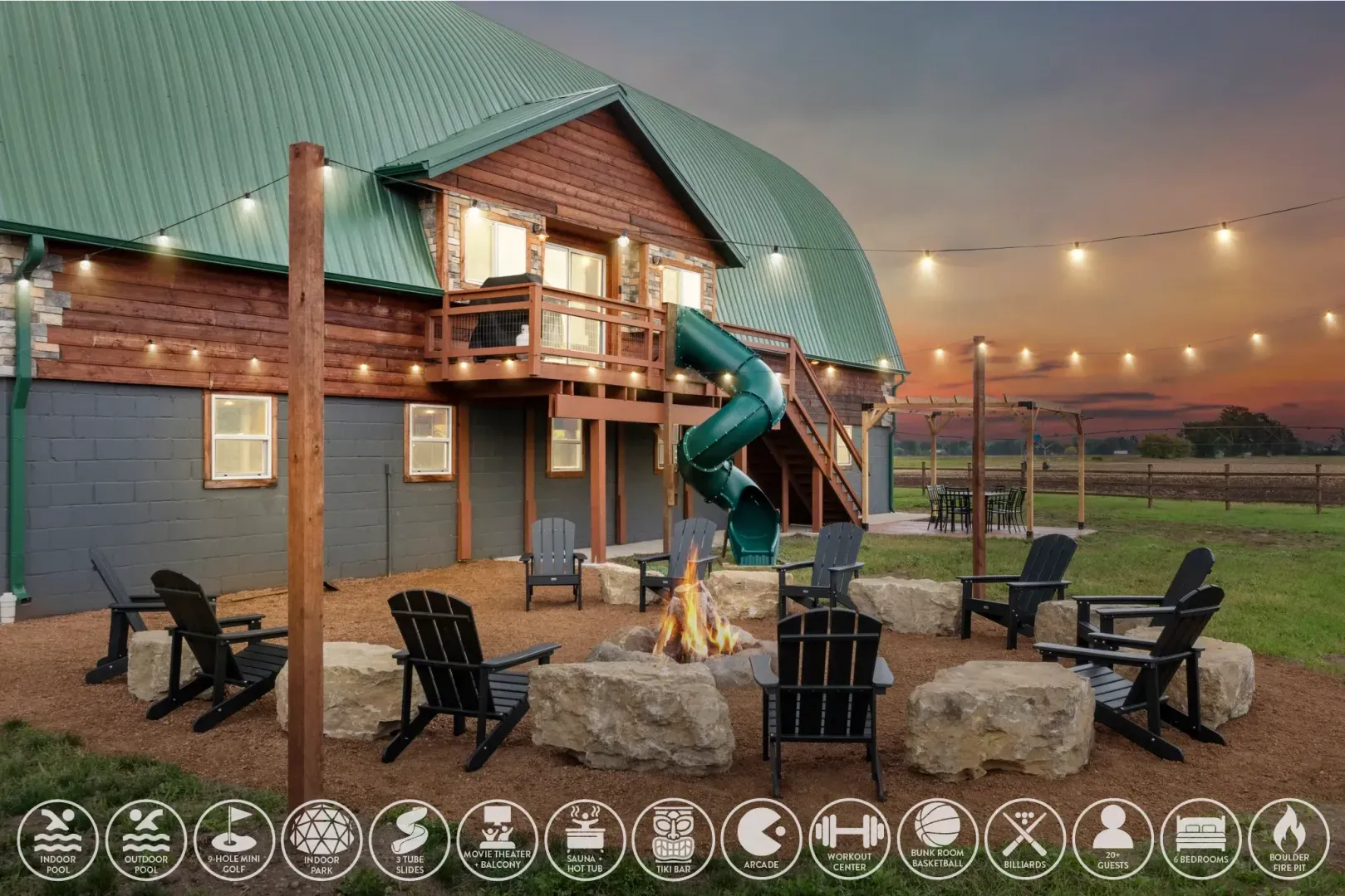 Big Sky Barnhouse Arena property — sunset over the barn, slide, fire pit, and string-lit yard for groups