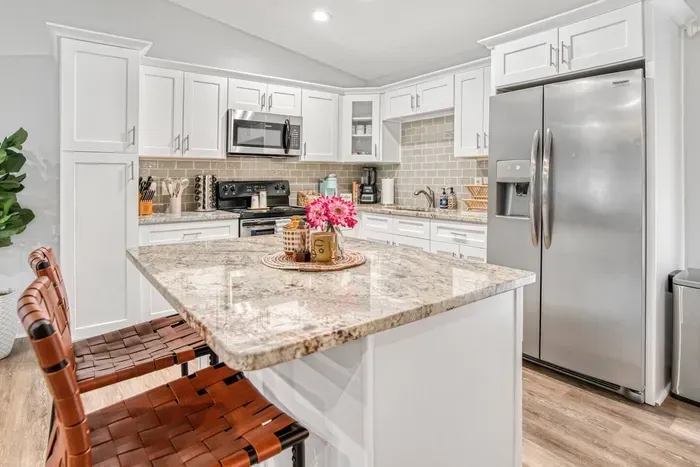 Modern kitchen fully stocked with all the equipment needed to cook meals.