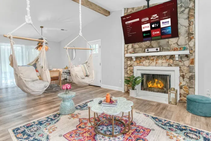 Unique custom made swing hammock chairs in beautifully decorated living area. (*250lbs weight limit per hammock*).