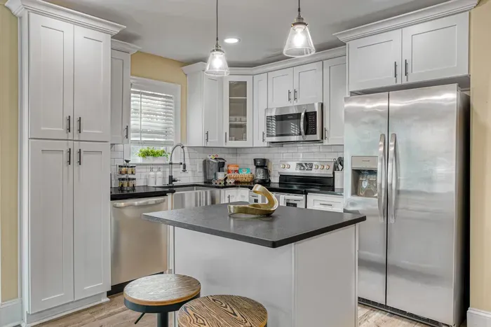 Step into a modern kitchen designed to inspire, with sleek countertops, high-end appliances, and thoughtful touches