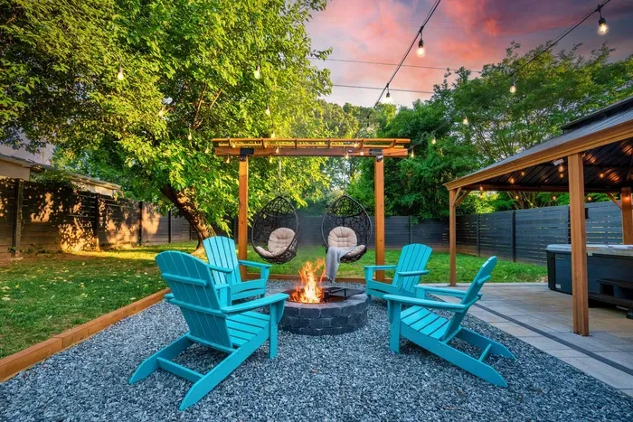 Cozy up around the fire pit, with hanging egg chairs and Adirondack chairs.