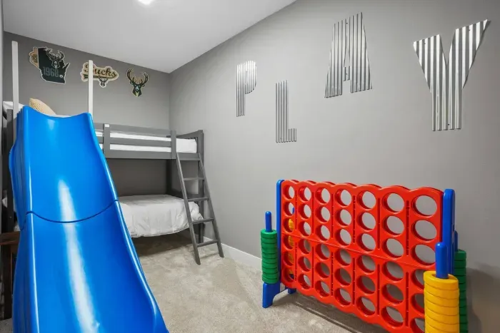 Kids Bunk Room with custom slide and giant connect four