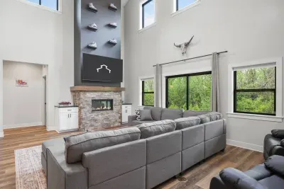 Large living room with Nike-Outlet esque themed TV mantle wall