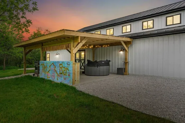 TIKI BAR! On the back covered patio w/ a hot tub + outdoor lounge + Weber Grill!