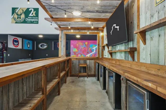 Custom sports bar made of refurbished Wisconsin barnwood (75" TV + mini fridges)