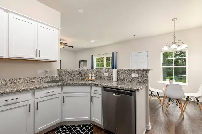 Modern kitchen with granite countertops, stainless steel appliances, coffee station, and everything you need for a home-cooked meal.