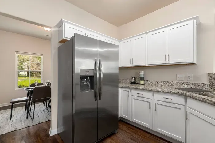 Modern kitchen with granite countertops, stainless steel appliances, coffee station, and everything you need for a home-cooked meal.