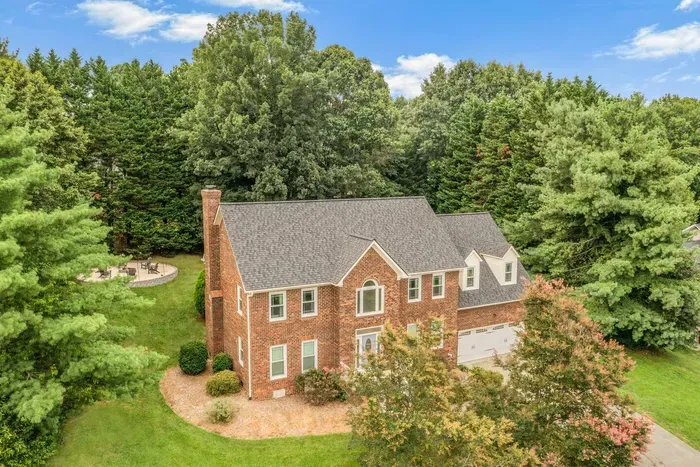 Aerial view of the property showcasing its expansive space and surrounding greenery