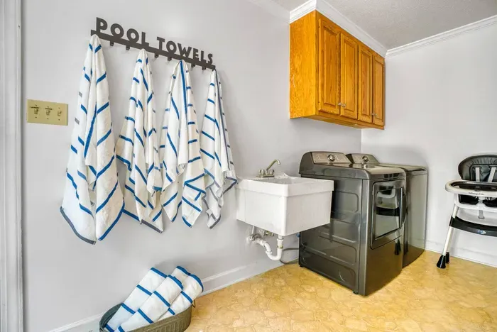 Laundry room with a brand new GE washer and dryer.