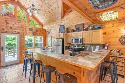 Large breakfast bar surrounding the kitchen
