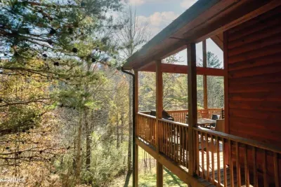 The covered deck wraps around to both 1st floor master suites