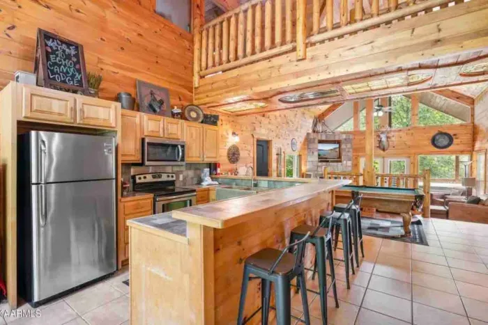 Fully equipped kitchen ready for your group cookouts. Custom-designed stained glass ceiling under the 2nd floor hallway.