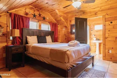 Master Suite #3 on 2nd floor with queen sized bed. Full bathroom attached.
